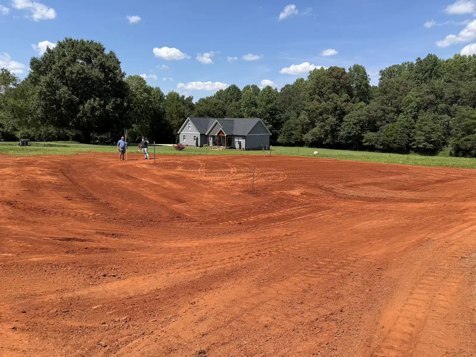 A large front lot shaped and graded in front of a new home &mdash; Little Acres Grading