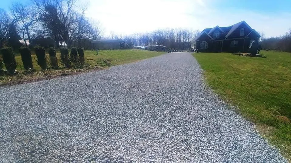 A long straight gravel drive graded and crowned to shed water &mdash; Little Acres Grading