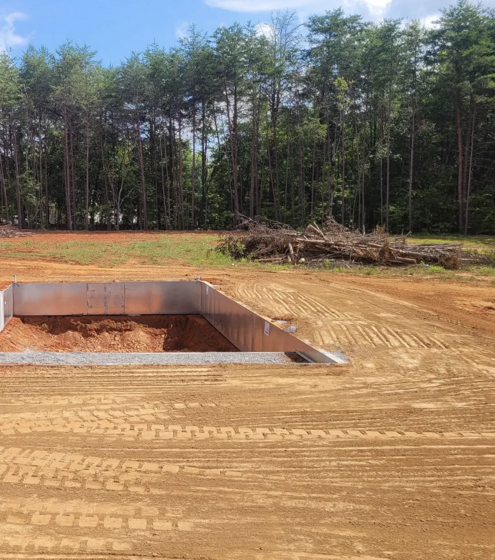 Steel wall panels set in a fresh pool excavation &mdash; Little Acres Grading